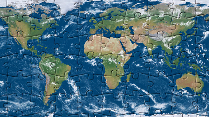 Weltkarte aus vielen Puzzelteilen