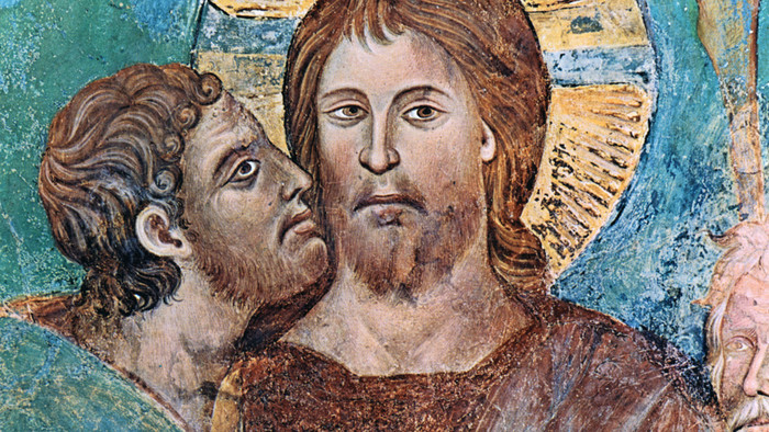 Gemälde von Jesus mit Heiligenschein und Judas, der ihm scheinbar etwas ins Ohr sagt